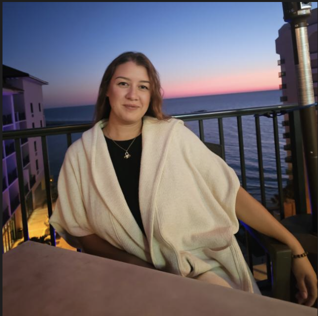 Massage therapist portrait by the ocean at sunset